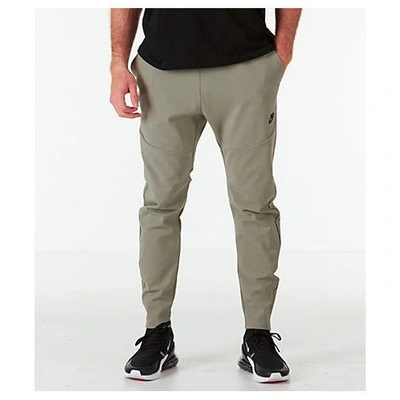 Shop Nike Men's Sportswear Tech Woven Jogger Pants, Green