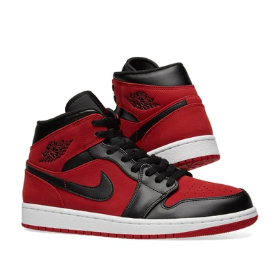 Shop Nike Air Jordan 1 Mid In Red