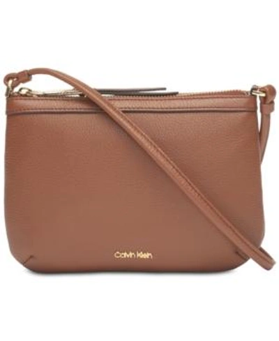 Shop Calvin Klein Carrie Pebble Leather Crossbody In Walnut/gold