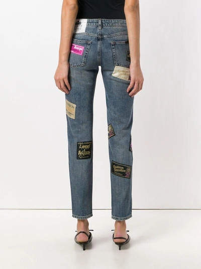 Shop Dolce & Gabbana Patched Slim Jeans - Blue