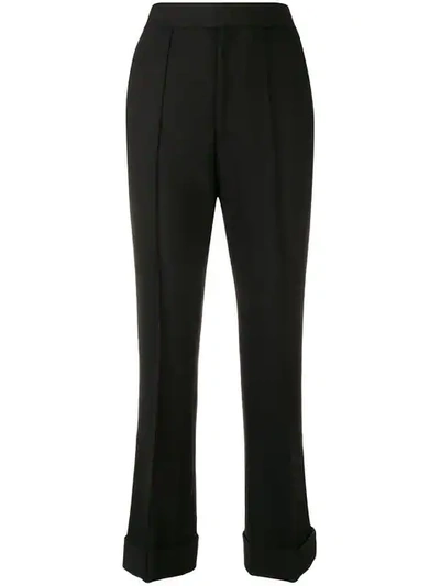 high-waisted flared trousers