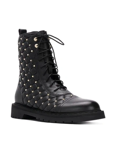 Shop Valentino Garavani Rockstud Quilted Boots - Black
