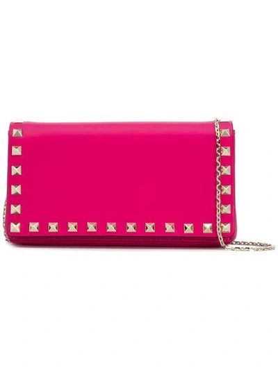 Shop Valentino Rockstud Clutch In Pink