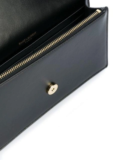 Shop Saint Laurent Tassel Plaque Shoulder Bag - Black