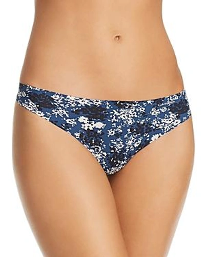 Shop Calvin Klein Invisibles Thong In Blue/floral Print