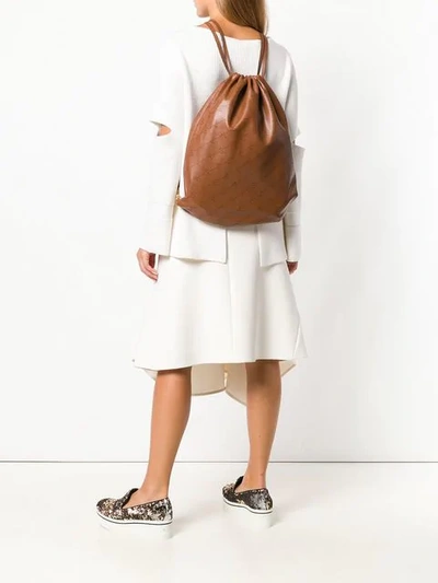 Shop Stella Mccartney Logo Perforated Drawstring Backpack In Brown