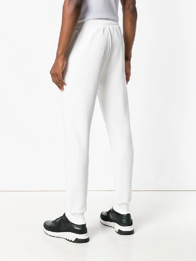 Shop Moschino Track Trousers - White