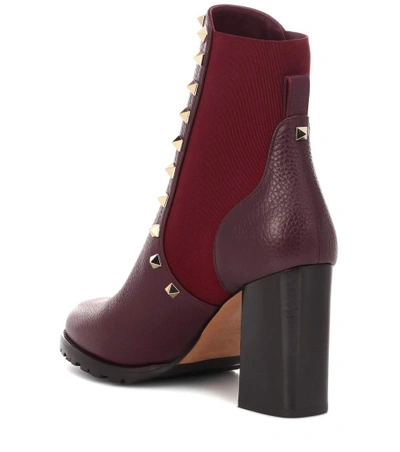 Shop Valentino Rockstud Leather Ankle Boots In Red