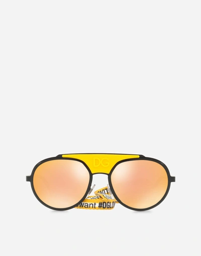 Shop Dolce & Gabbana Madison Sunglasses In Black And Yellow