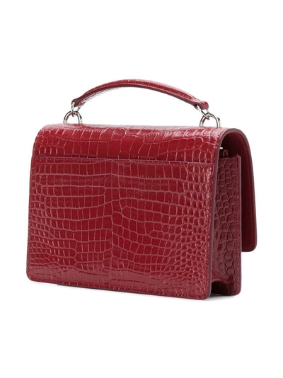 Shop Saint Laurent Embossed Mini Crossbody Bag - Red