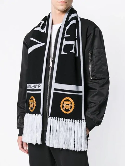 Shop Versace Fringed Logo Scarf In Black