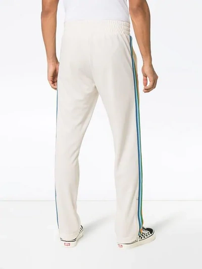 Shop Palm Angels Logo Printed Side Stripe Track Trousers In White