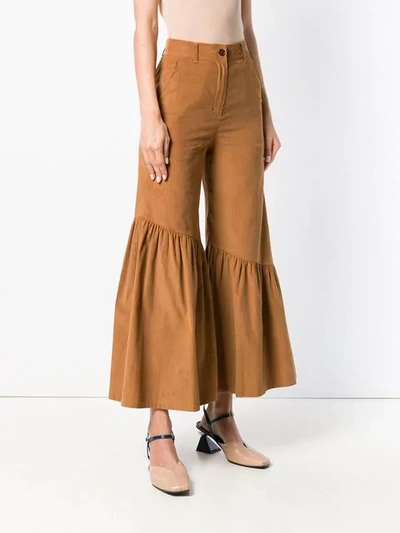 Shop Neul Ruffled Hem Trousers In Brown