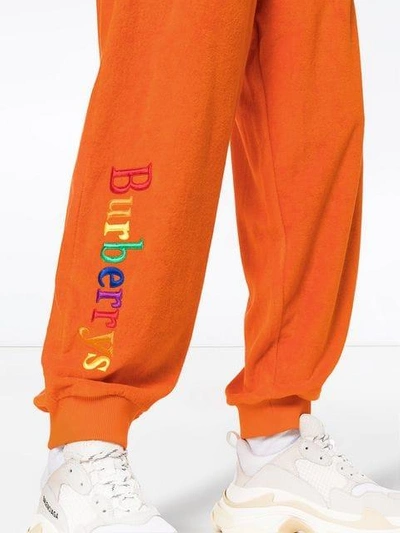 Shop Burberry Logo Tracksuit Bottoms In Yellow & Orange