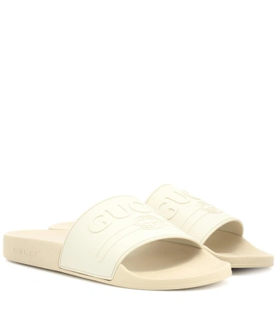 Shop Gucci Logo-embossed Slides In White