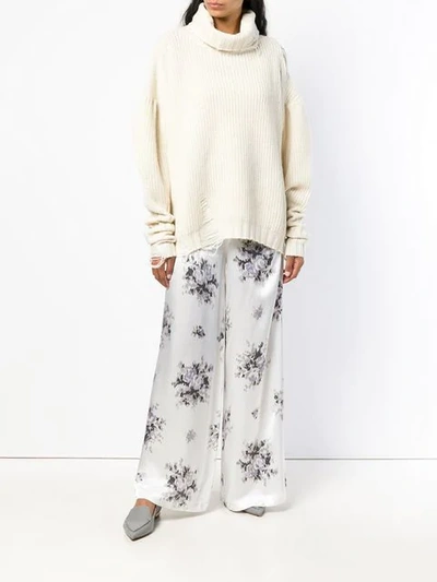 Shop Ganni Floral Print Trousers In White