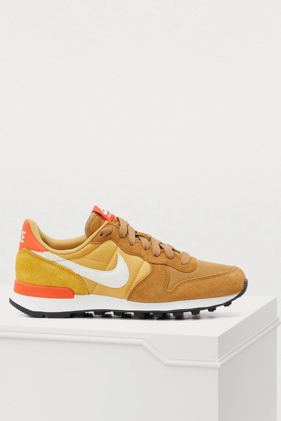 Shop Nike Internationalist Sneakers In Muted Gold / Summit White-wheat Gold