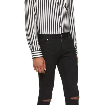 Shop Balmain Black Destroyed Skinny Jeans In 176 Black