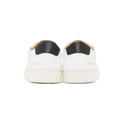 Shop Common Projects Woman By  White Retro Low Sneakers In 0506 White