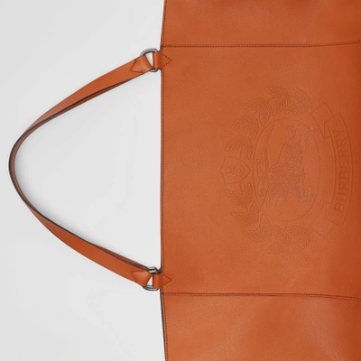 Shop Burberry Large Embossed Crest Bonded Leather Tote In Bright Tan