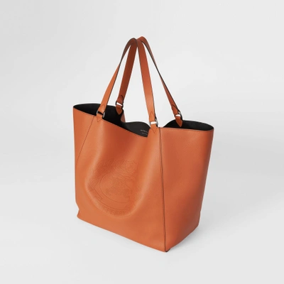 Shop Burberry Large Embossed Crest Bonded Leather Tote In Bright Tan