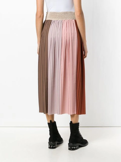 high-waisted pleated skirt