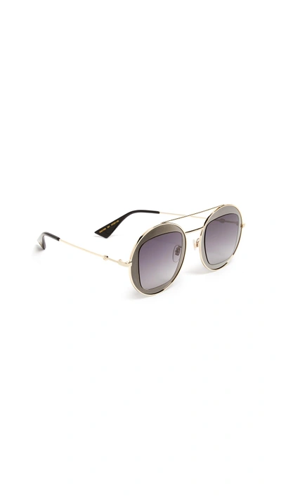 Shop Gucci Urban Round Sunglasses In Grey/black/gold