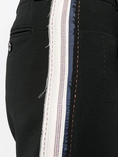 Shop Carven Side Striped Trousers In Black