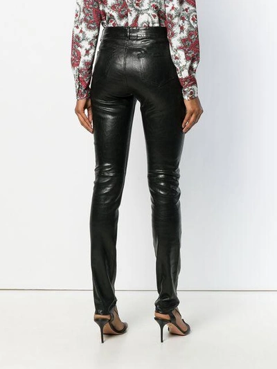Shop Saint Laurent Skinny Trousers In Black