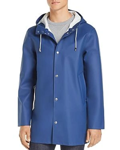 Shop Stutterheim Stockholm Hooded Raincoat In Indigo