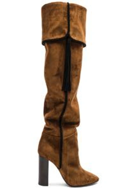 Shop Saint Laurent Suede Meurice Tassel Slouchy Boots In Brown. In Caramel & Black