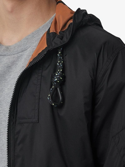 Shop Burberry Hooded Windbreaker Jacket - Black