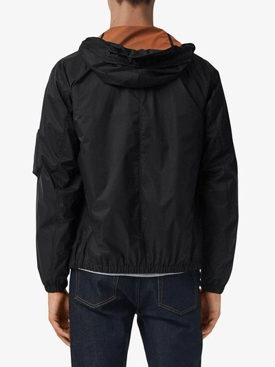 Shop Burberry Hooded Windbreaker Jacket - Black