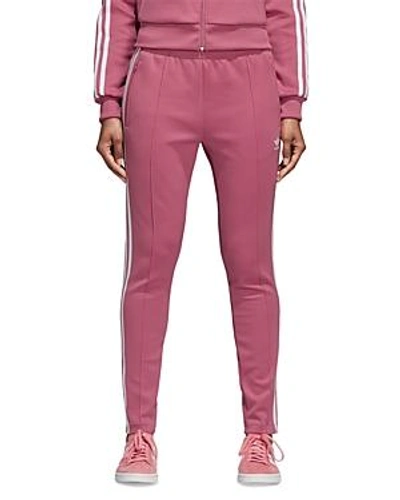 Shop Adidas Originals Sst Track Pants In Trace Maroon