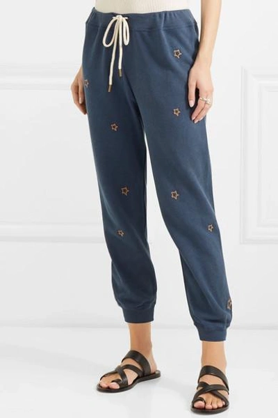 Shop The Great The Cropped Embroidered Cotton-jersey Track Pants In Navy