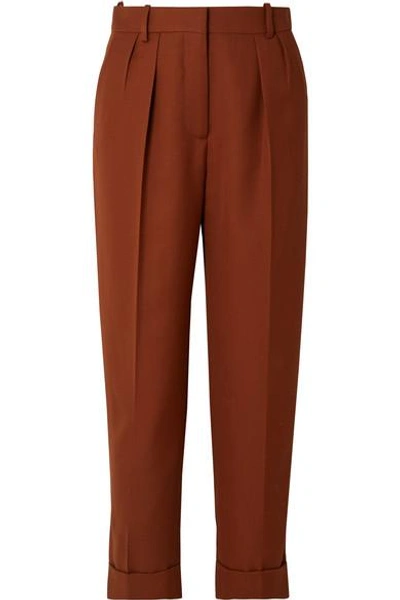 Shop Victoria Beckham Cropped Pleated Grain De Poudre Wool Tapered Pants In Brick