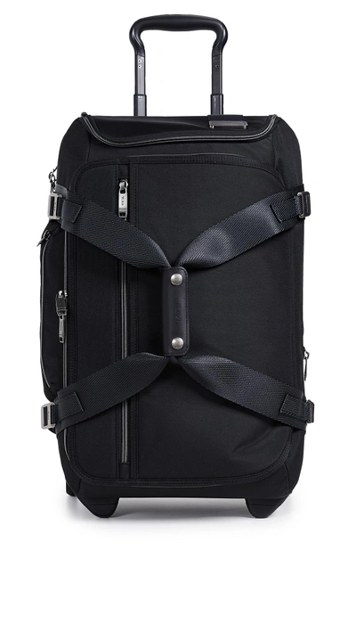 Shop Tumi Merge Wheeled Duffel Carry On Suitcase In Black