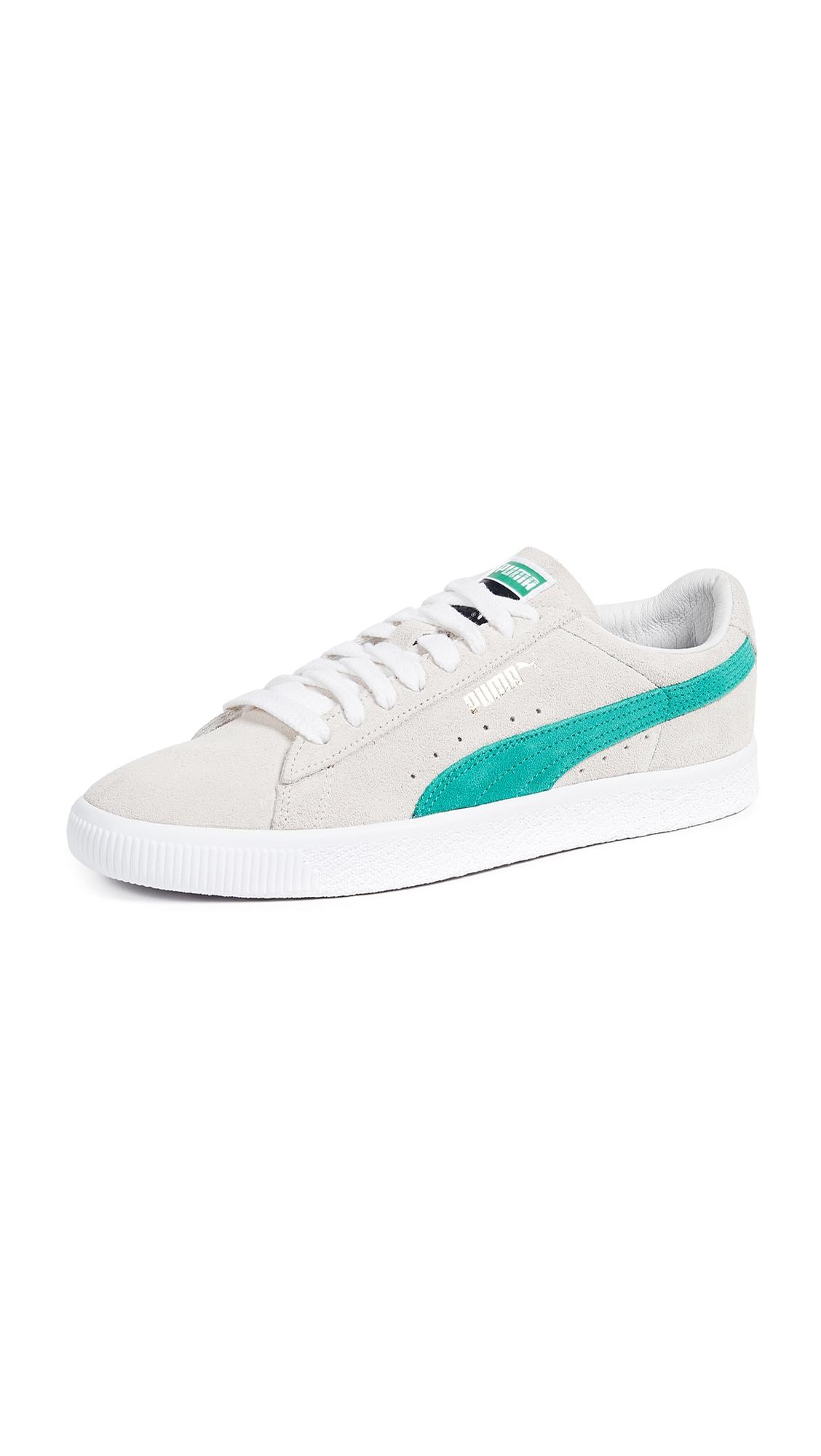 green and white suede pumas