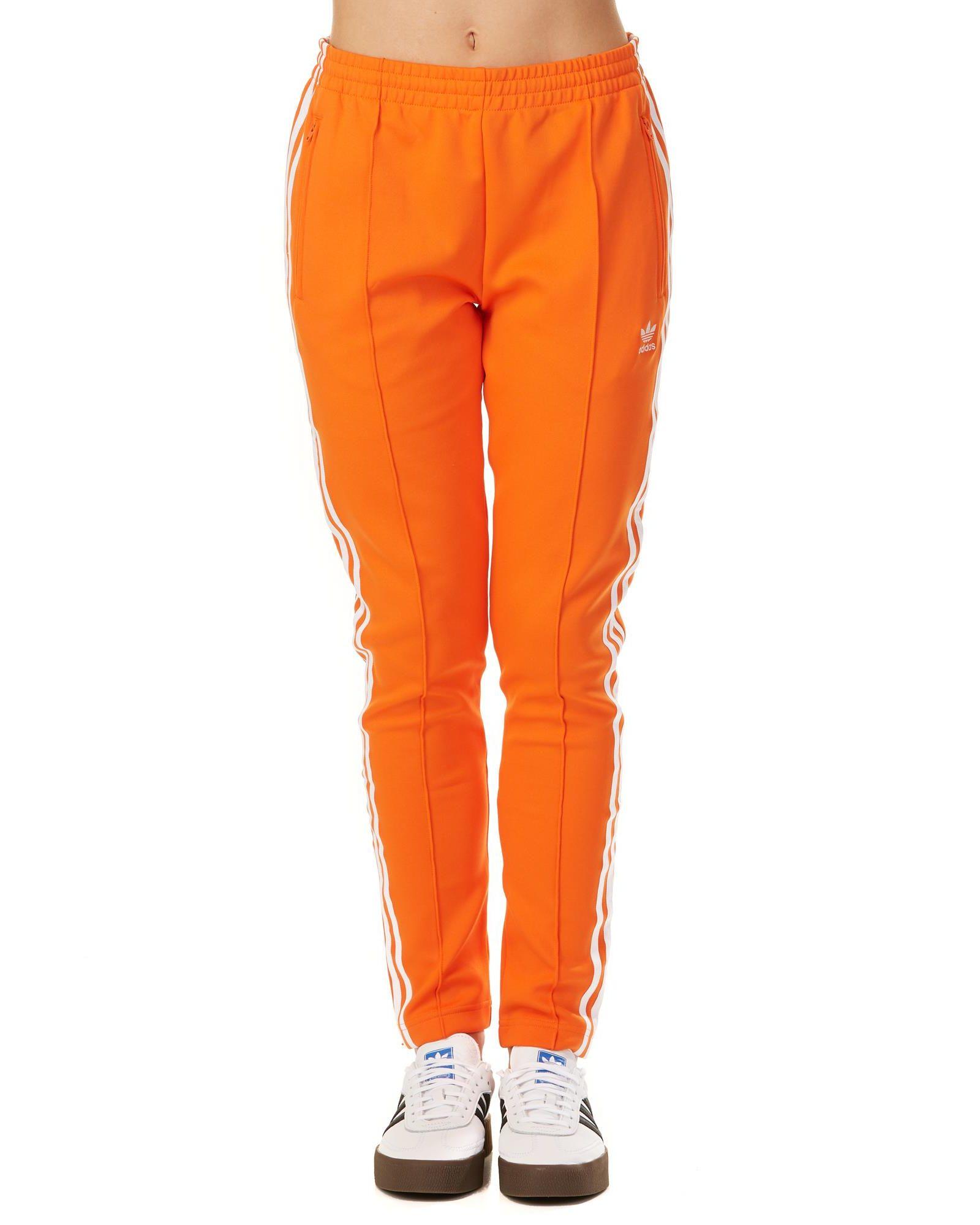 adidas sst track pants orange
