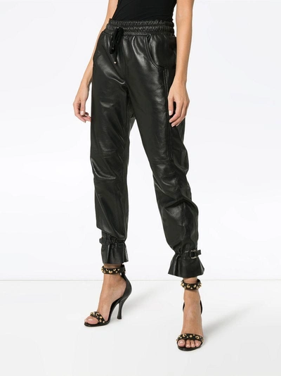 Shop Skiim Gaby High-waisted Leather Track Pants - Black