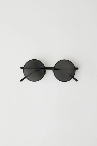 Shop Acne Studios Round Sunglasses Black Satin/black