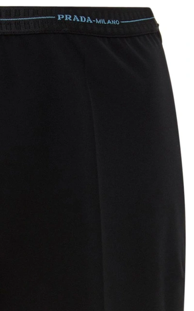 Shop Prada Stretch-knit Slim-leg Trousers  In Black