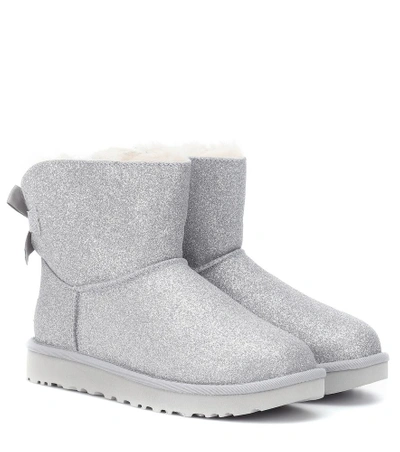 Shop Ugg Mini Bailey Bow Glitter Ankle Boots In Silver