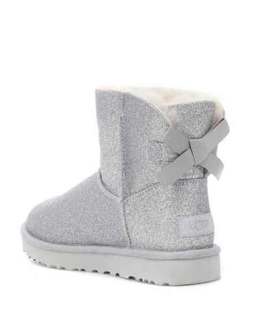 Shop Ugg Mini Bailey Bow Glitter Ankle Boots In Silver