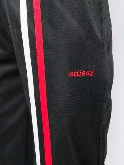 Shop Stussy Striped Track Pants - Black