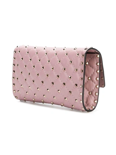 Shop Valentino Garavani Rockstud Spike Crossbody Bag - Pink In Pink & Purple