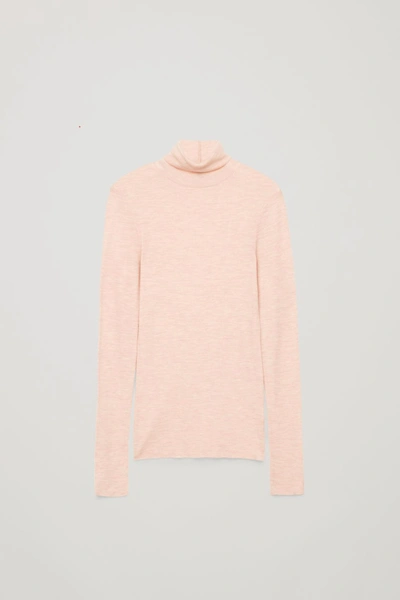 Shop Cos Fine Turtleneck Wool Top In Pink Melange