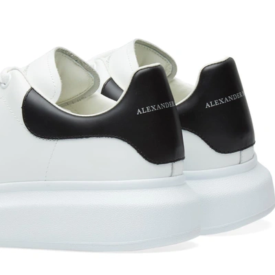 Shop Alexander Mcqueen Wedge Sole Stud Front Sneaker In White