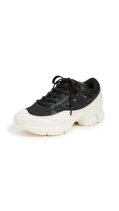 Shop Adidas Originals Raf Simons Ozweego Sneakers In Cream White/core Black