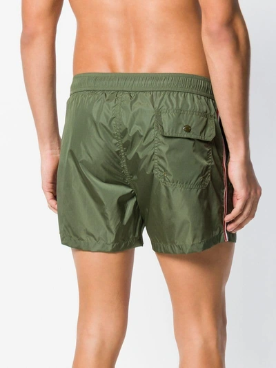 Shop Moncler Striped Trim Swim Shorts In Green